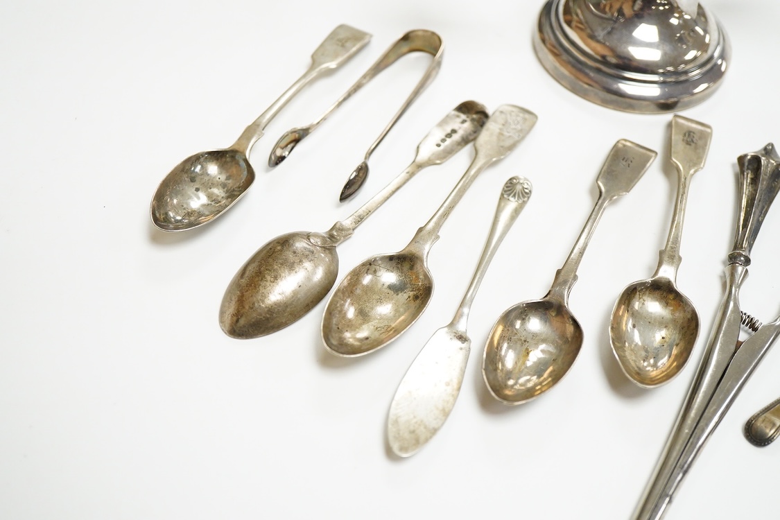 A small group of silver including a modern two branch, three light dwarf candelabrum by Sanders & Mackenzie, height 10.2cm, weighted, a pair of handled glove stretchers and eight small items of flatware.